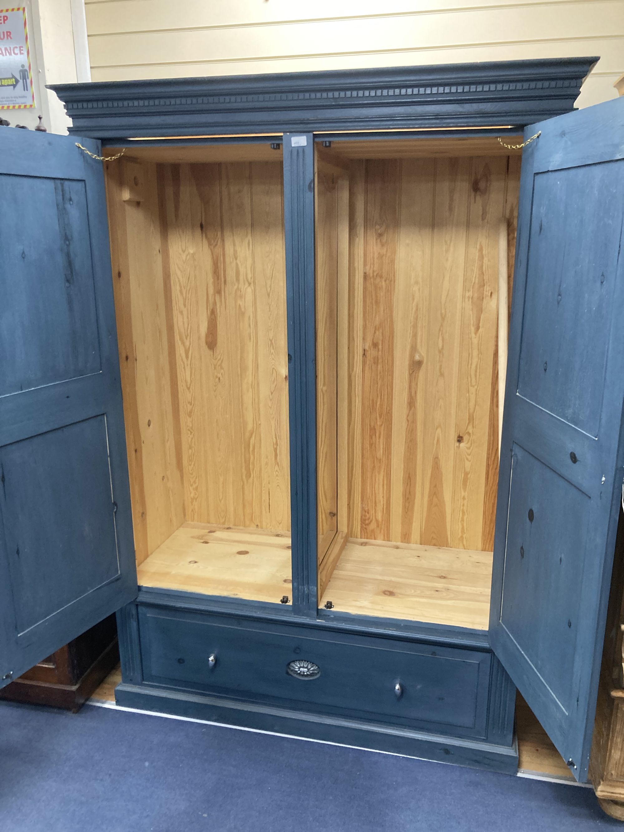 A Victorian style blue painted panelled pine two door wardrobe, width 140cm depth 60cm height 198cm